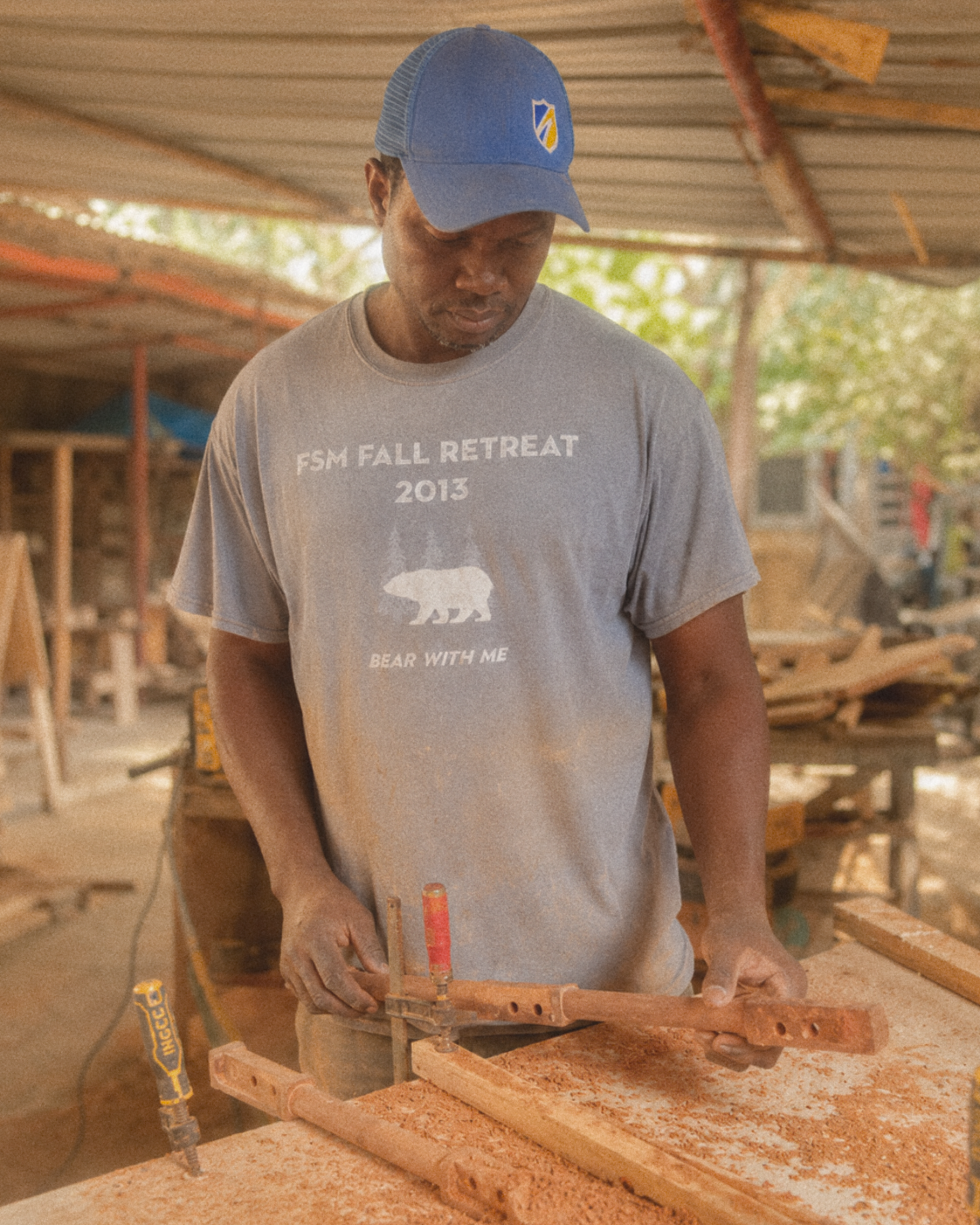 Abdoulaye Traoré Diop fitting the neck of a xalam in the workshop