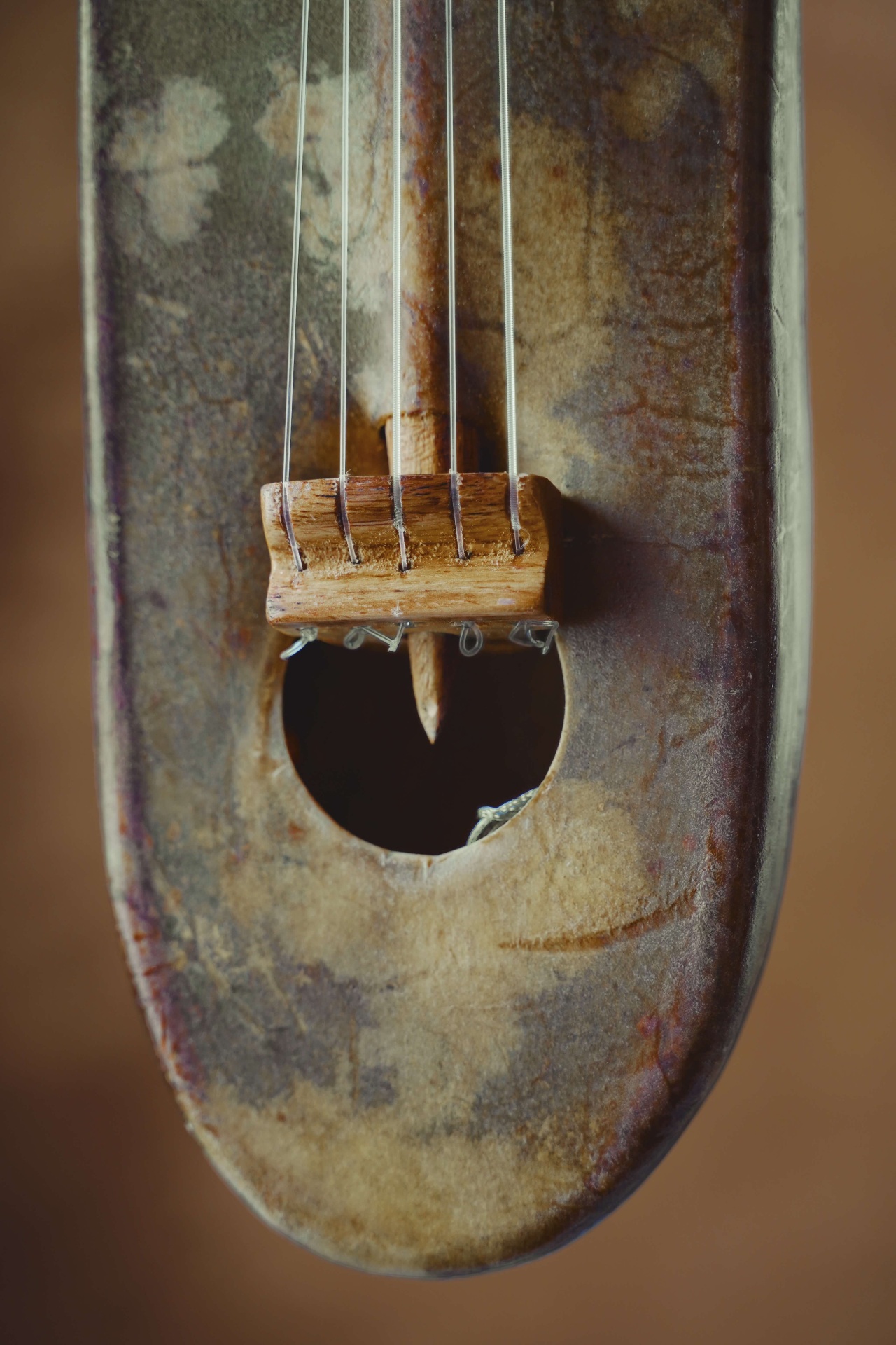Close-up of the xalam bridge and sound hole